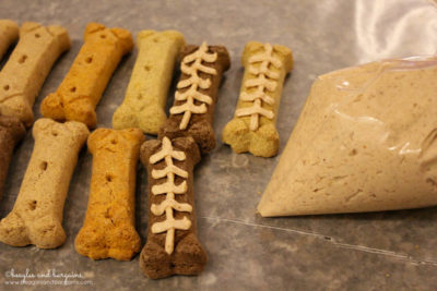 Frost Peanut Butter Frosting onto store bought dog treats for a festive football look!